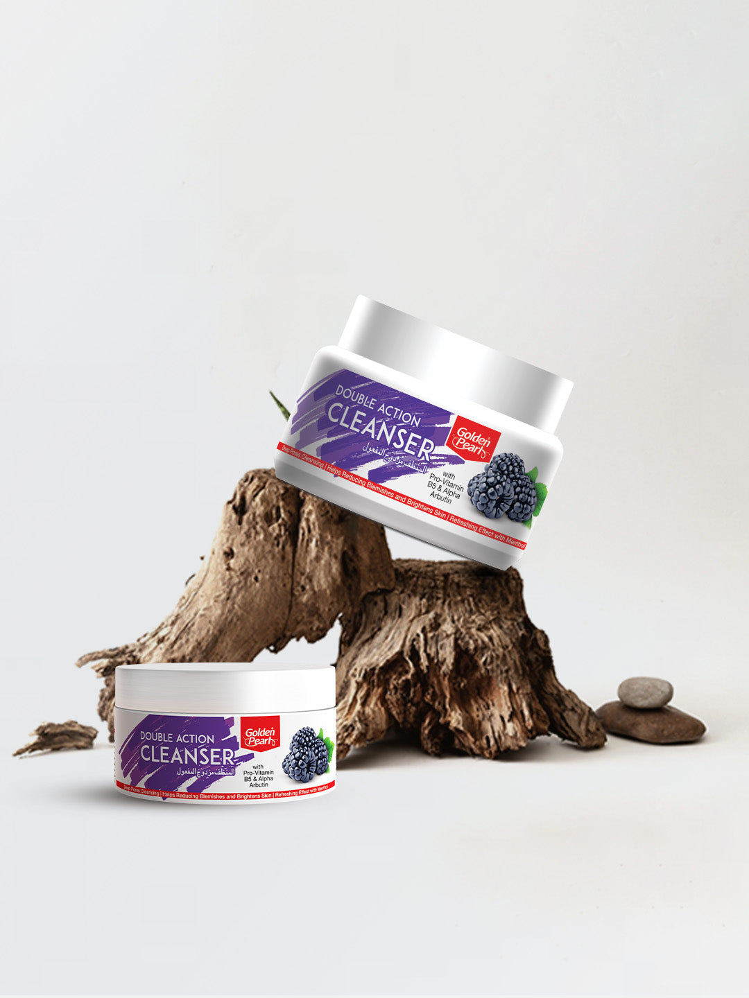 Two containers of Double Action Cleanser on a white background with a wooden log and stones.