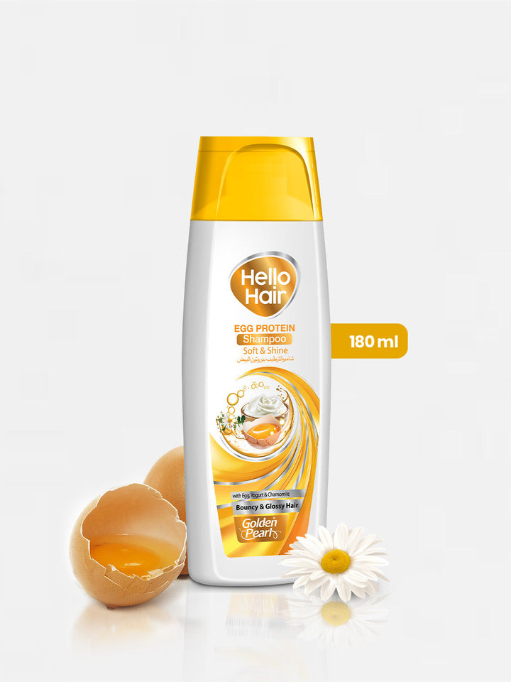 Shampoo bottle with egg and flower on a white background