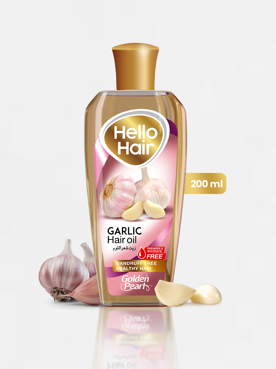 Bottle of Hello Hair Garlic Hair Oil with garlic bulbs on a white background