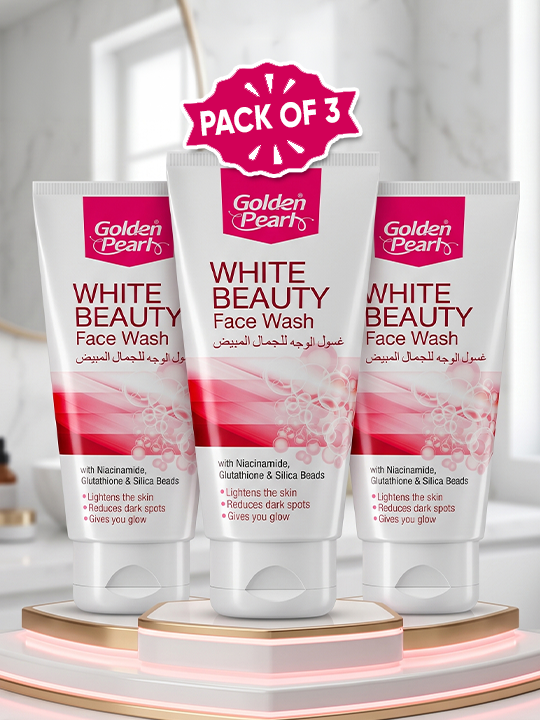 Three tubes of Golden Pearl White Beauty Face Wash arranged on a tiered display stand, with a red 'PACK OF 3' badge above them. The tubes are white with pink and red graphics and text, set against a softly blurred bathroom background.